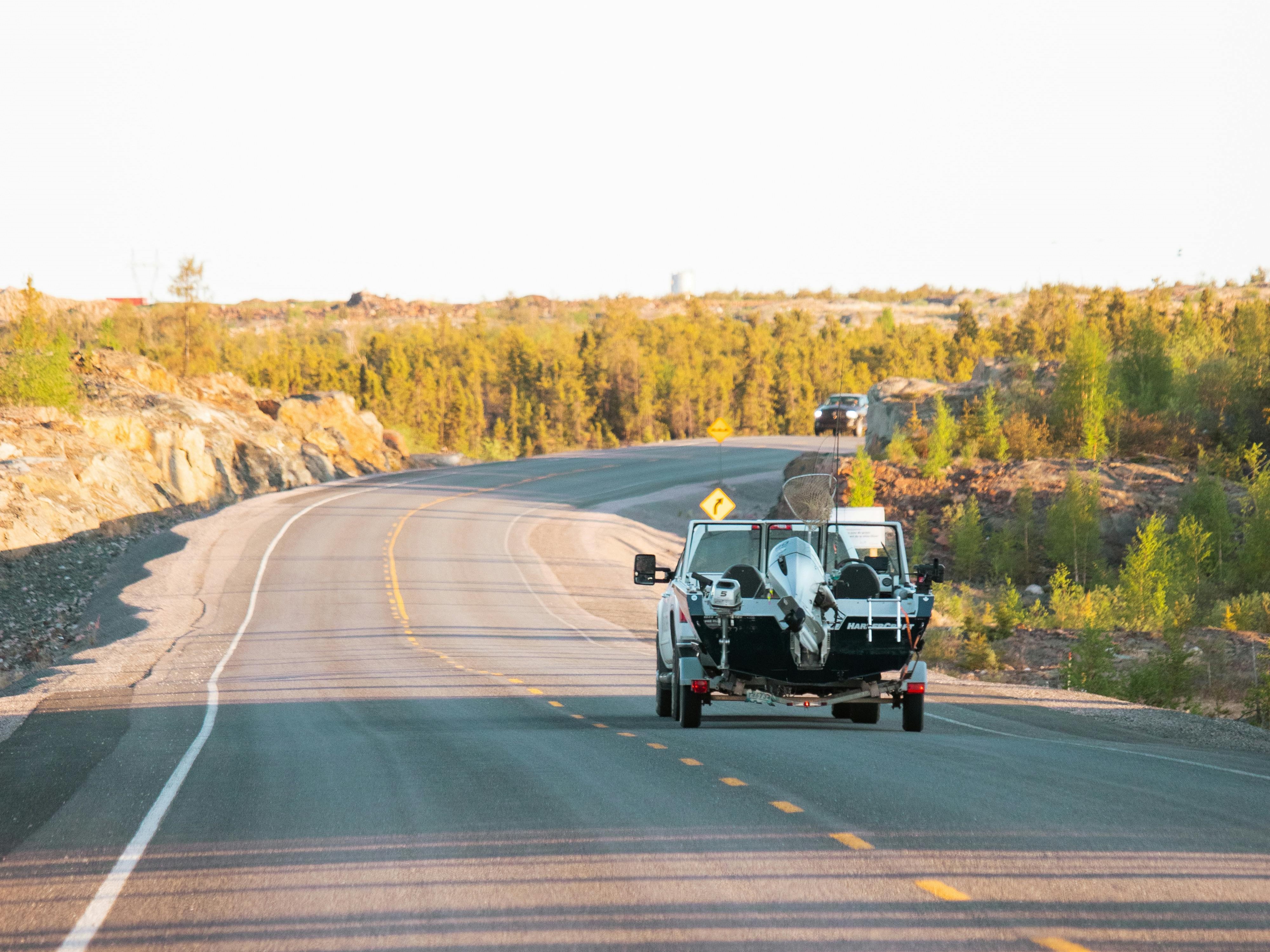 Car towing a boat trailer